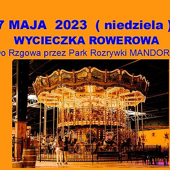 Plakat promujący wycieczkę rowerową do Rzgowa (przez Park Rozrywki Mandoria) - niebieskie napisy na pomarańczowym tle. Zdjęcie karuzeli.